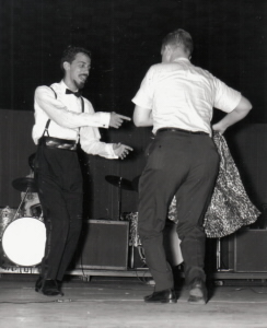 Adam onstage in 1962 at WINN emcee event