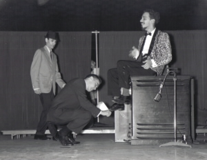 Adam onstage in 1962 at WINN emcee event